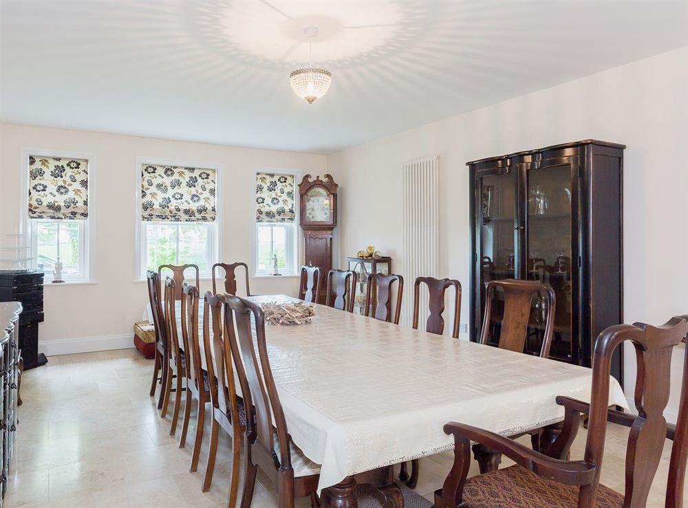 Formal dining room with elegant table and chairs at Yokefleet Cottage in Sandholme, near Beverley, North Humberside