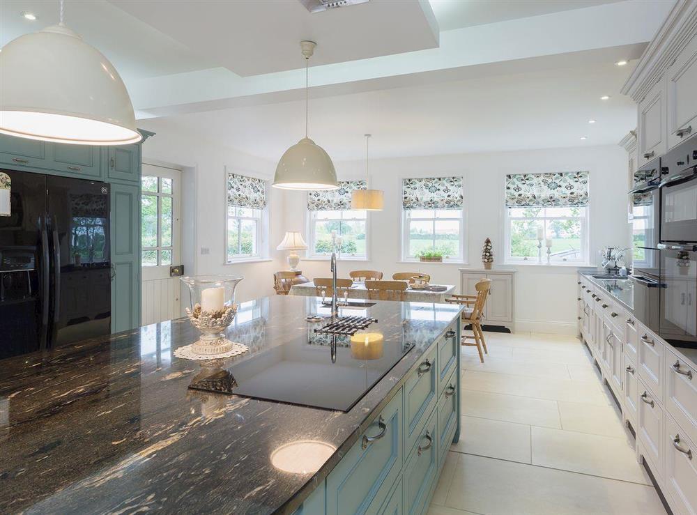 Luxurious kitchen with marble worktops and induction hob at Yokefleet Cottage in Sandholme, near Beverley, North Humberside