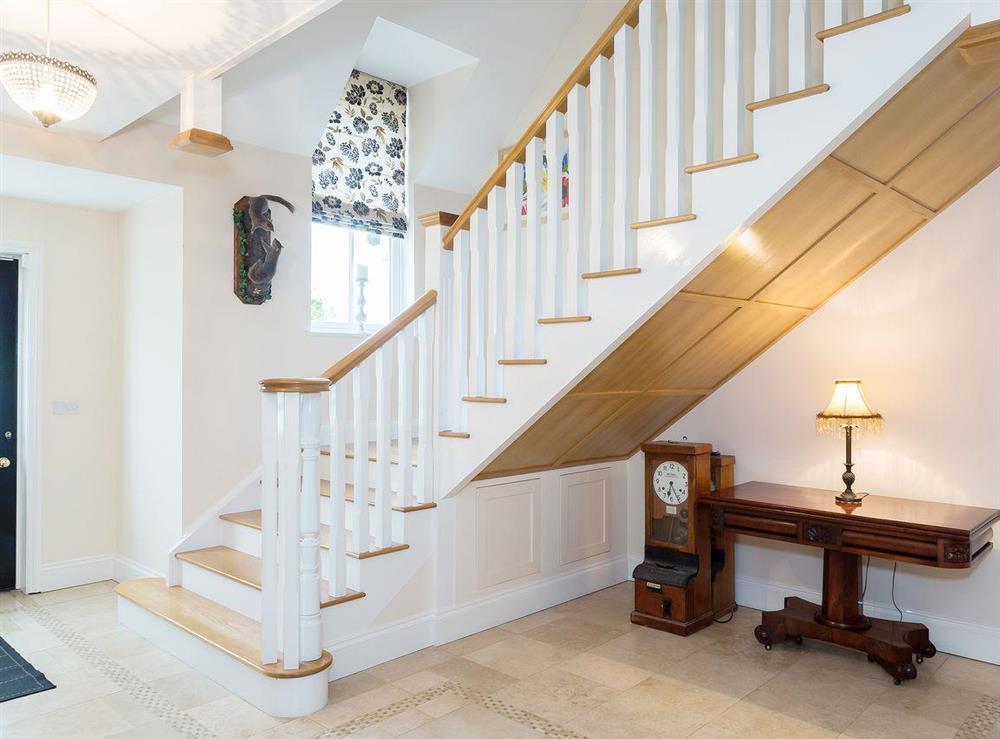 Spacious entrance hallway and stairway to the first floor at Yokefleet Cottage in Sandholme, near Beverley, North Humberside