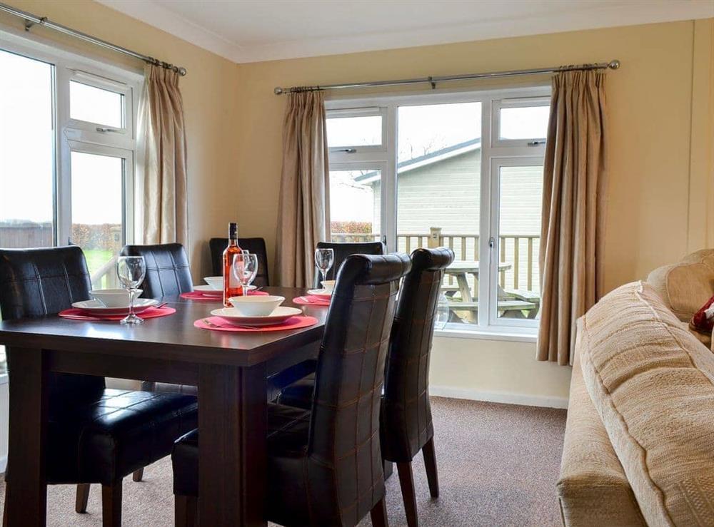 Bright and comfortable living/dining area (photo 3) at Yonder Green Lodge in St. Ervan near Padstow, Cornwall