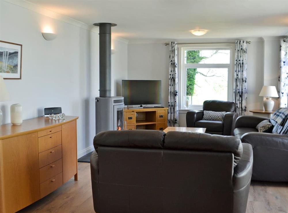 Beautifully presented living area with wood burner at McGill Cottage, 