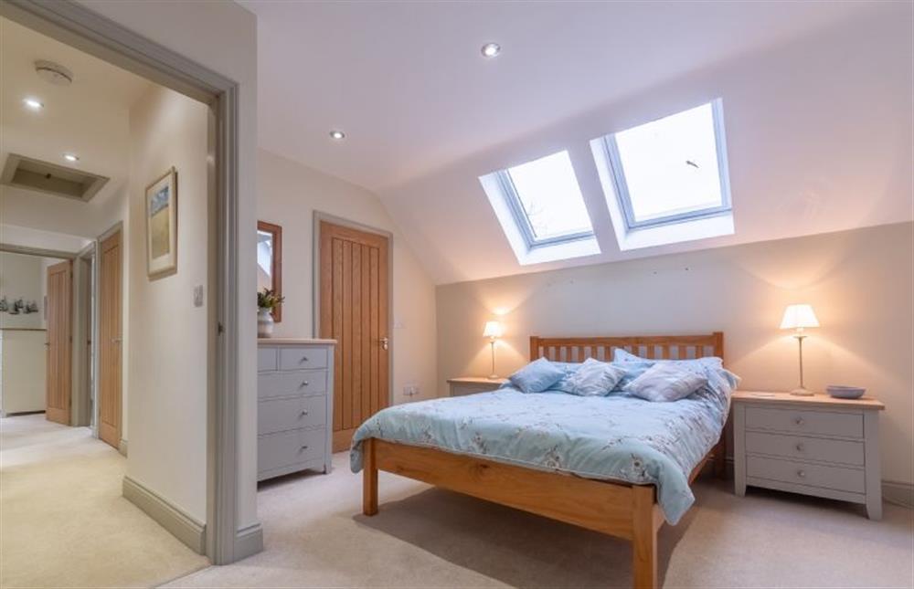 First floor: Master bedroom with king-size bed at York Cottage, Docking near Kings Lynn