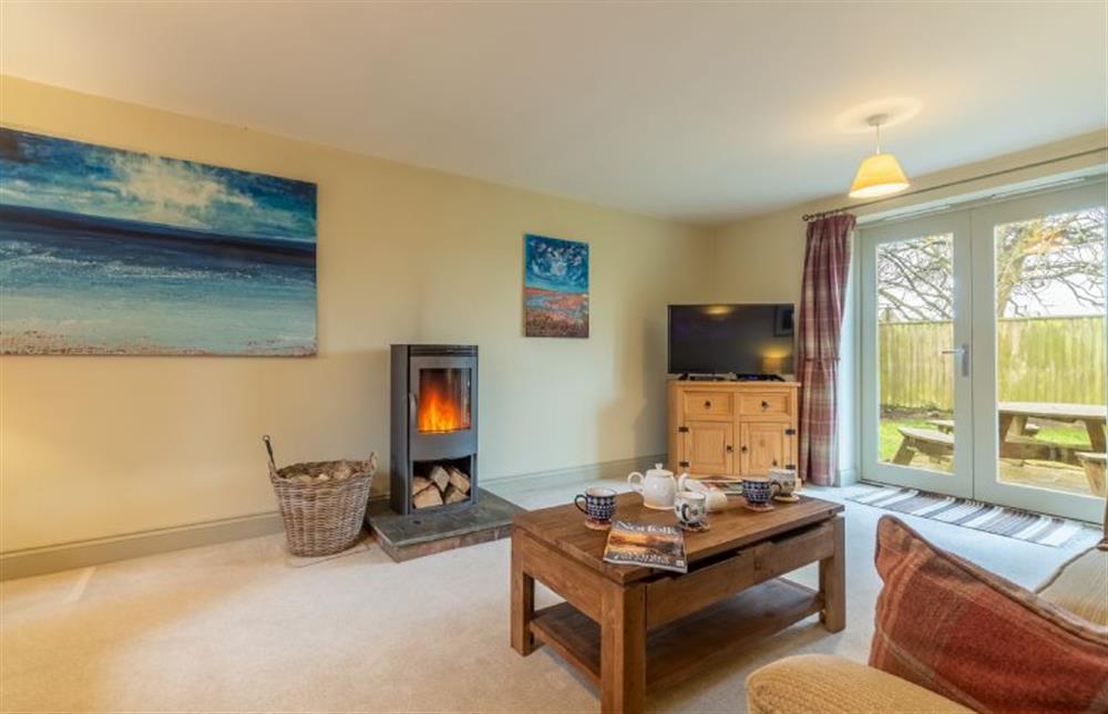 Ground floor: The sitting room has a wood burning stove
