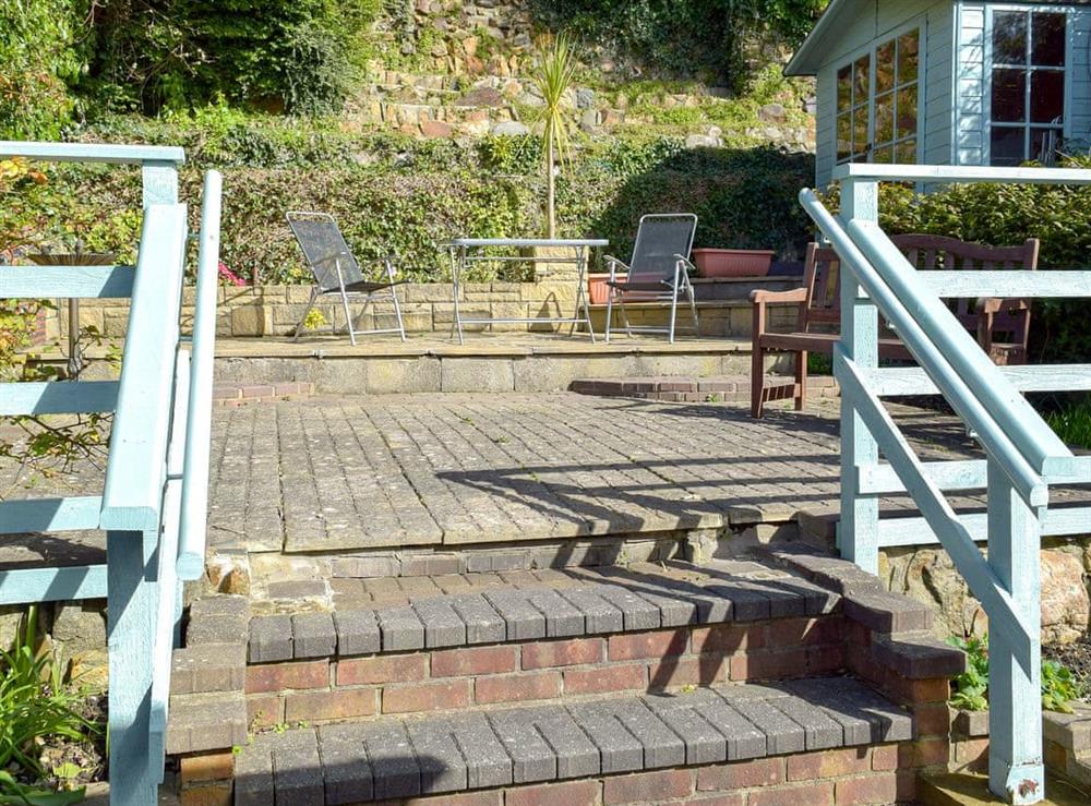 Enclosed terraced courtyard with garden furniture at Yorke Villa in Fishguard, Pembrokeshire, Dyfed