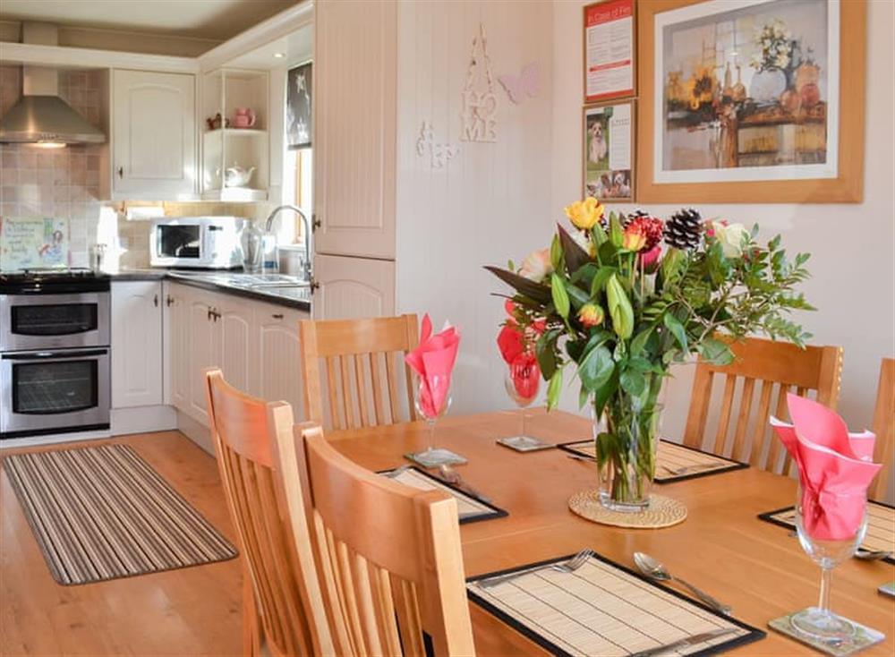 Dining table and chairs through to the kitchen at Yorkshire Rose in Sewerby, near Bridlington, North Humberside