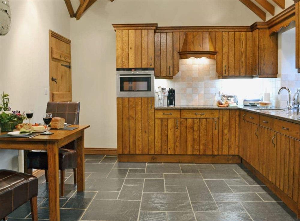 Open plan living/dining room/kitchen (photo 4) at Yr Efail in Machynlleth, Powys