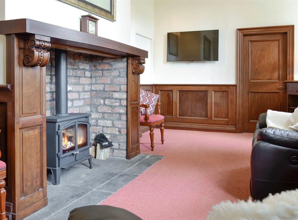 Welcoming living room with wood burner at Yr Hen Fanc in Trawsfynydd, near Blaenau Ffestiniog, Gwynedd