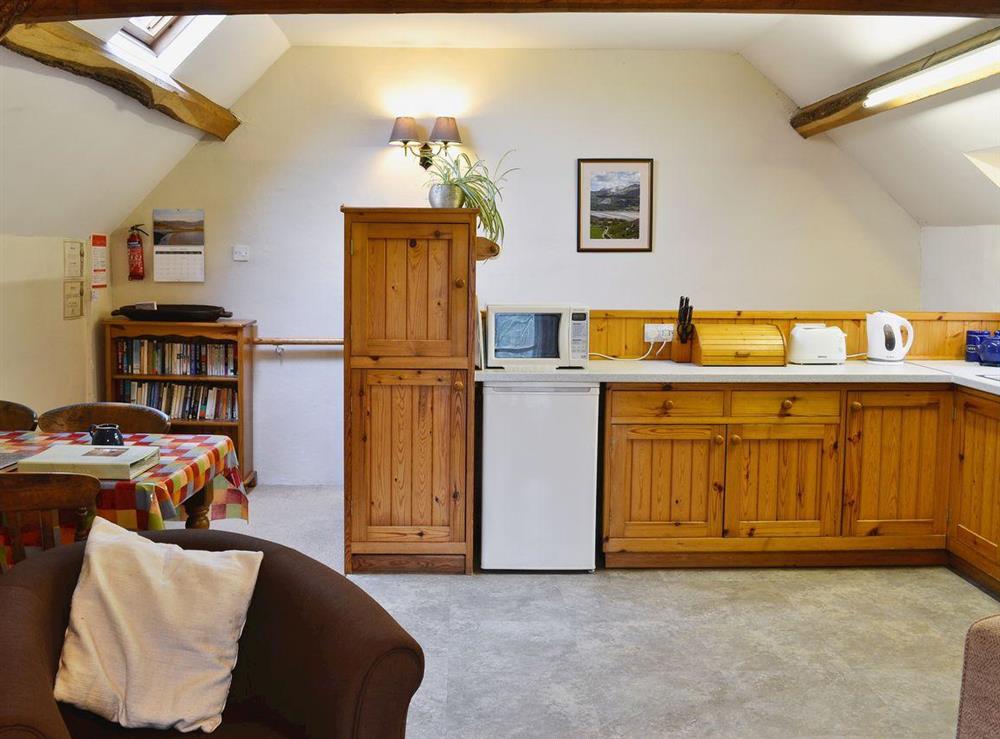 Open plan living/dining room and kitchen at Yr Hen Stabl in Arthog, near Dolgellau, Gwynedd