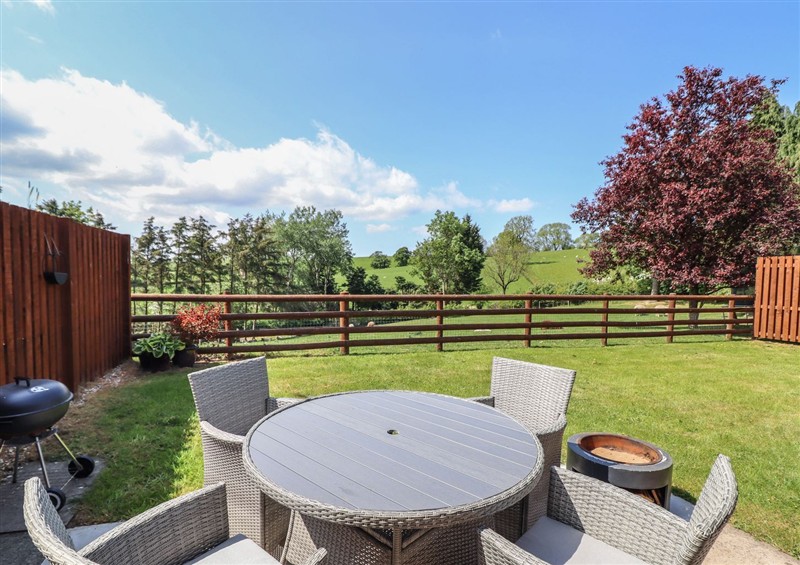 Enjoy the garden at Ysgubor Fachwen, Tregynon near Bettws Cedewain