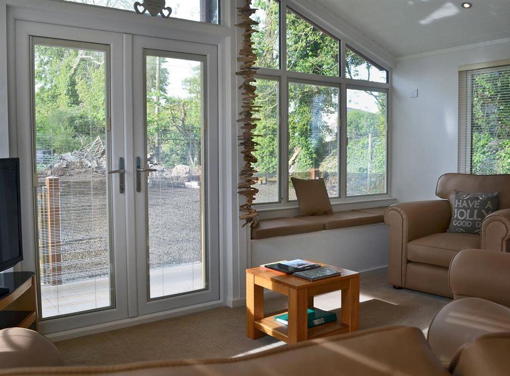 Cosy living room area with patio doors at Ein Yfory, 