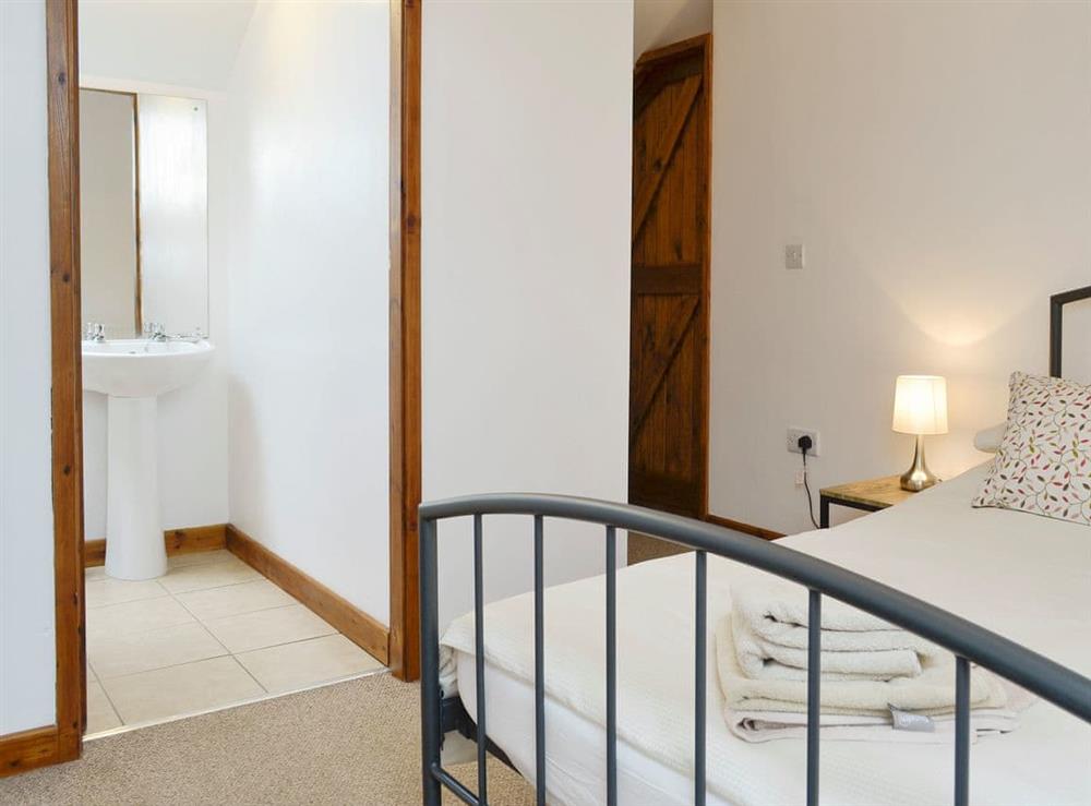 Comfortable double bedroom with en-suite shower room at Ysgubor in Tregarth, near Bangor, Gwynedd