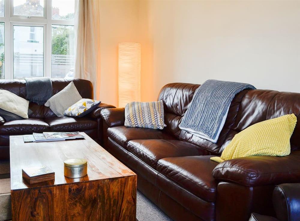 Comfortable leather sofas in the living room at Zonnebloem in Brymbo, near Wrexham, Clwyd