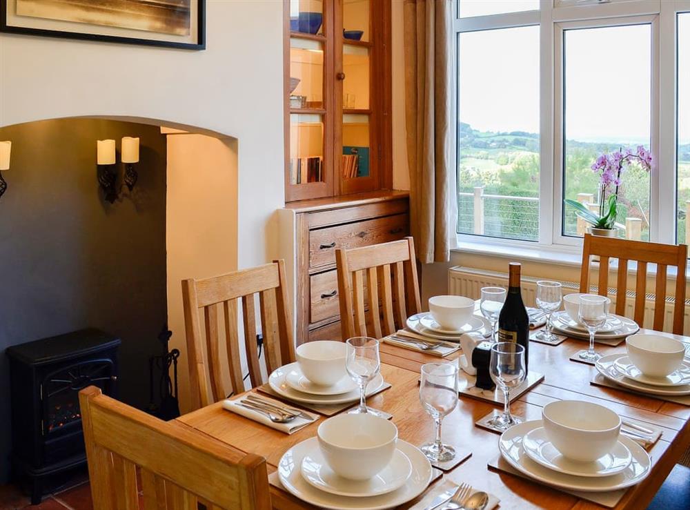 Delightful family dining room with electric coal effect fire at Zonnebloem in Brymbo, near Wrexham, Clwyd