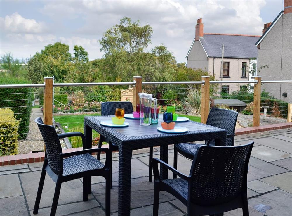 Flagged terrace with table and chairs at Zonnebloem in Brymbo, near Wrexham, Clwyd
